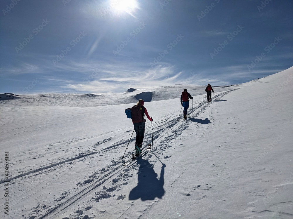 Skimo. Mountaineering in the alps of glarus. Ski tour in the swiss mountains. Winter landscape, ascent track, schilt
