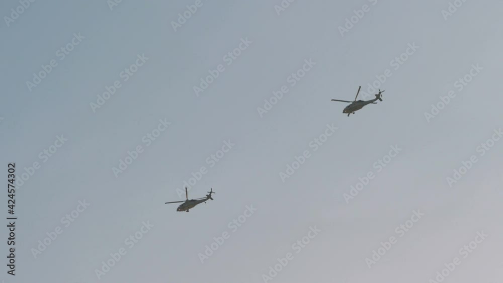 Helicopters flight on the sky in 4k slow motion 60fps Helicopters flight on the sky in 4k slow motion 60fps