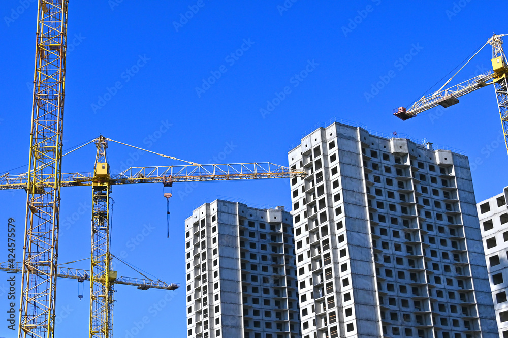 Crane and highrise construction site Crane and highrise construction site