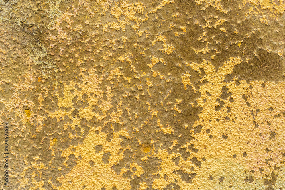 Weathered cement painted yellow wall texture Weathered cement painted yellow wall texture