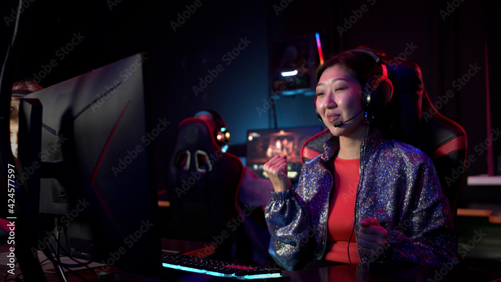 The last seconds of the esports online first face shooter match, the gamer girl in the computer club wins and rejoices The last seconds of the esports online first face shooter match, the gamer girl in the computer club wins and rejoices