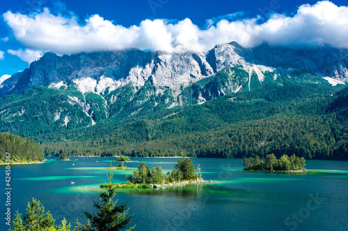 Faboulus landscape of Eibsee Lake with turquoise water in front of Zugspitze summit under sunlight. Location: Eibsee lake, Garmisch-Partenkirchen Bavarian alps, Germany, Europe photo