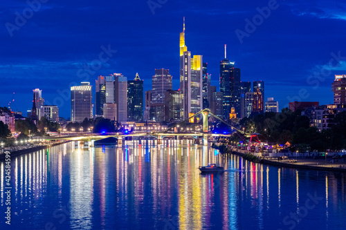 FRANKFURT  GERMANY  25 JULY 2020 Modern cityscape of the business district with reflection on the Main river at night