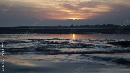 sunset over the sea west wittering beach england photo