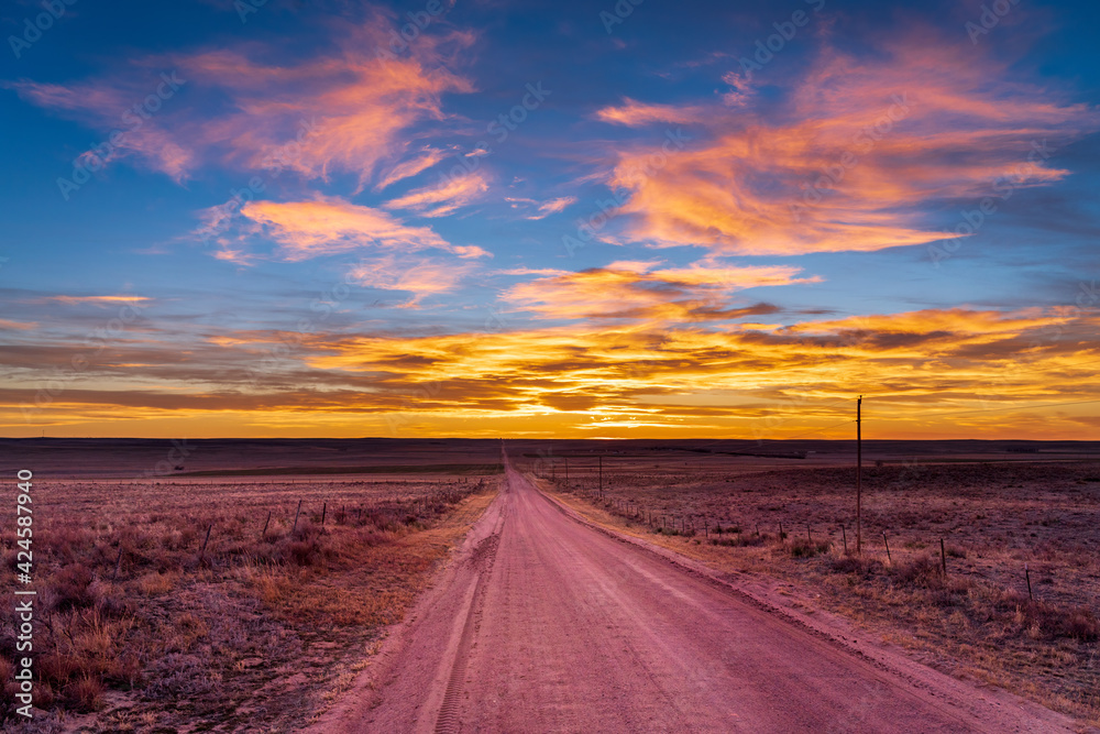 Gravel road to sunset