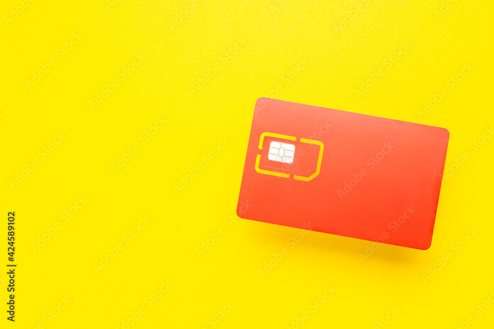 sim card for mobile phone isolated on yellow background. 4G sim card for smartphone cut out sim card for mobile phone isolated on yellow background. 4G sim card for smartphone cut out