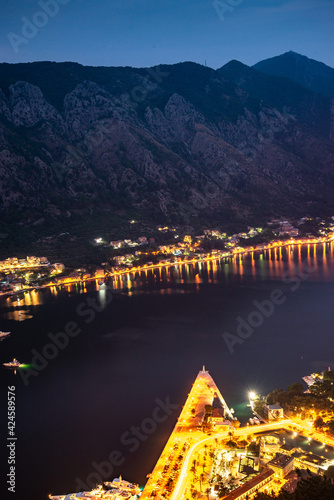 Kotor Bay and Old Town illumiinated at dusk seen from St John's Fortress and hilltop,Montenegro,Eastern Europe. photo