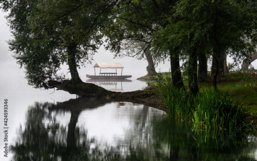 Obraz premium fog over the river with boat