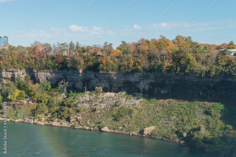 Rocky coast of Niagara river between Horseshoe Falls and American Falls