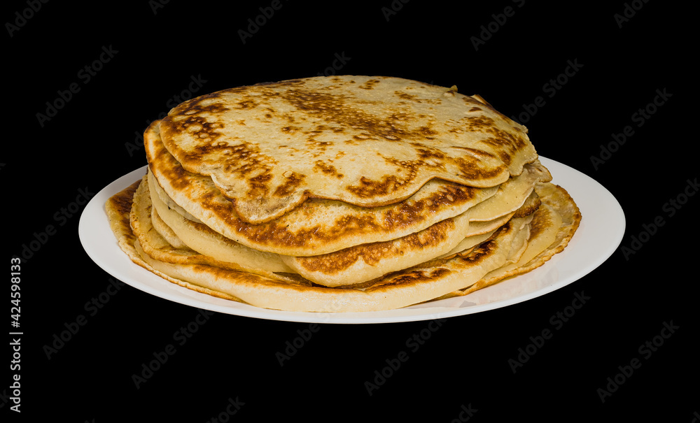 pancakes on a plate on a black background