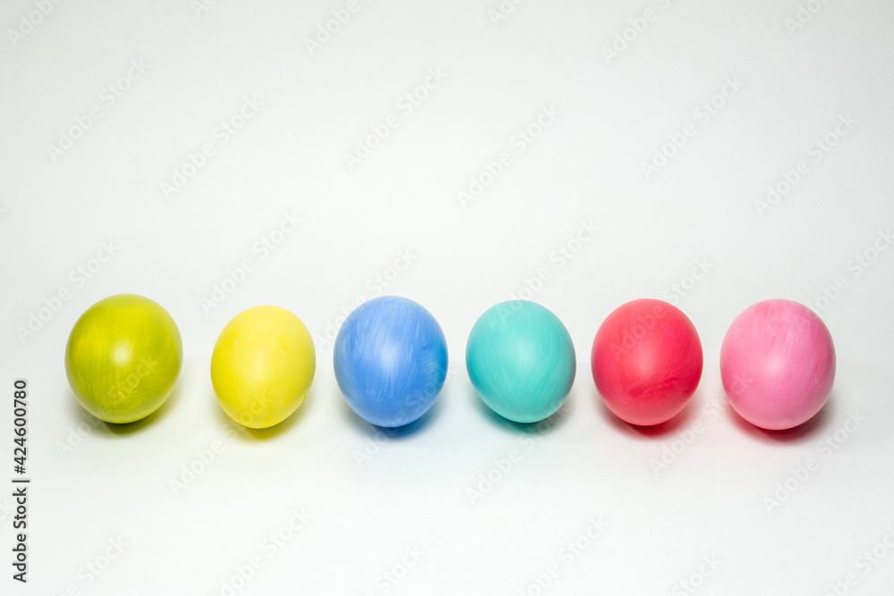 Six colorful eggs on white background. Creative Easter background Six colorful eggs on white background. Creative Easter background