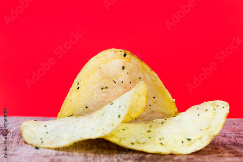 thin potato chips, crispy chips made from potatoes and deep fried
