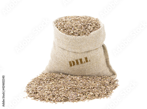Dill in a sack of isolated on a white background. Fennel. Seeds of Dill in a burlap sack. Healthy food. Dill in a jute bag. Vegan food.