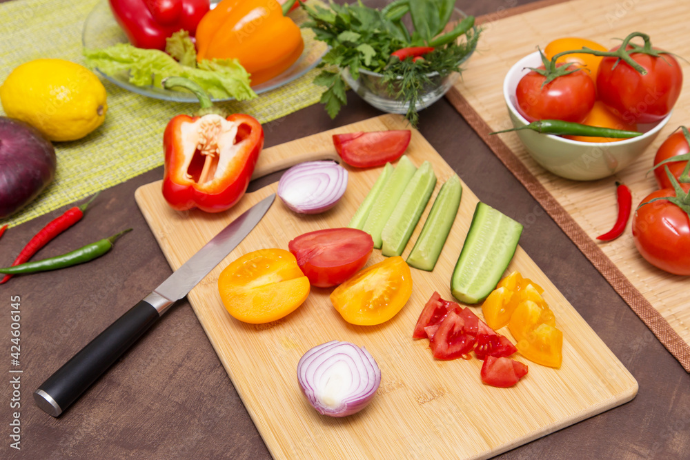 Various vegetables for cooking healthy vegetarian vegan diet food. Cutting vegetables on wooden board on kitchen Various vegetables for cooking healthy vegetarian vegan diet food. Cutting vegetables on wooden board on kitchen