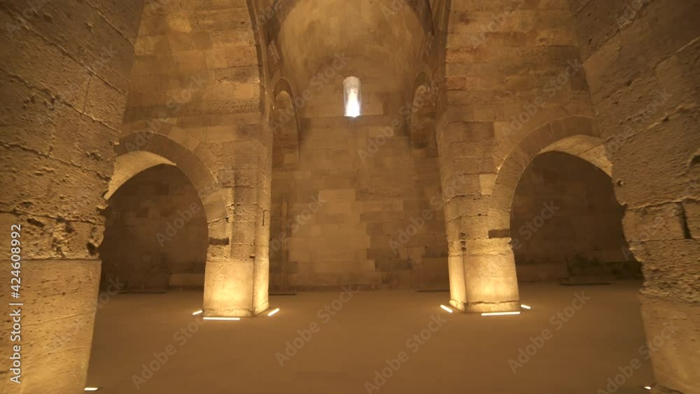 Interior of historical building with stone arches and domes.Cathedral minster church sultan Han caravanserai caravansary khan wikala funduq medieval architecture caravanserais niche courtyard detail. Interior of historical building with stone arches and domes.Cathedral minster church sultan Han caravanserai caravansary khan wikala funduq medieval architecture caravanserais niche courtyard detail.