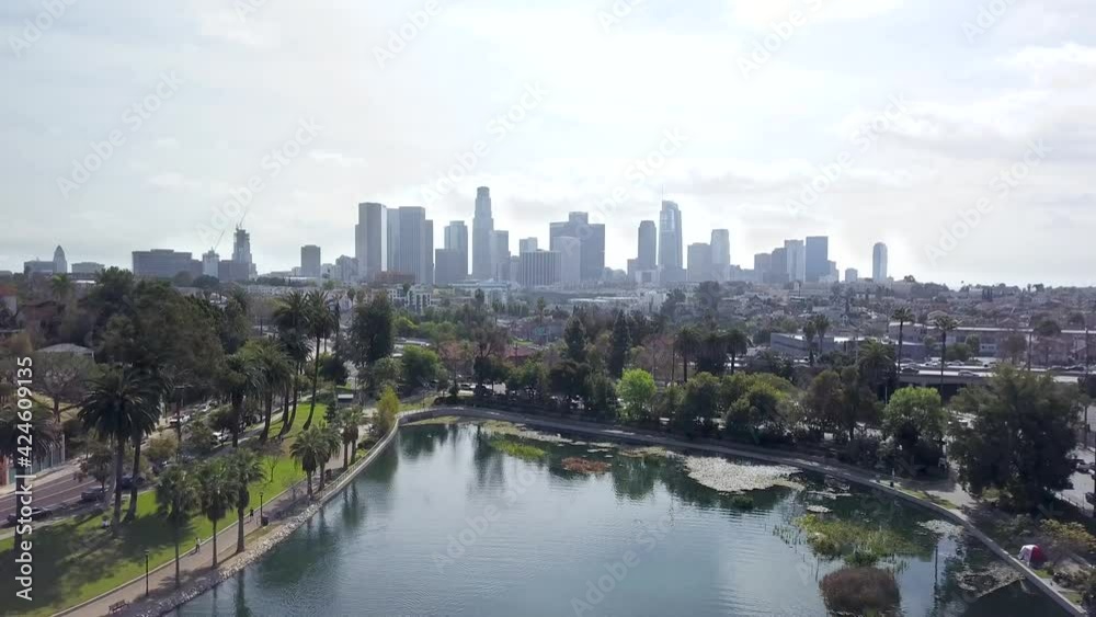 Aerial flying backwards over Echo Park lake showing the beautiful Los Angeles city skyline. Aerial flying backwards over Echo Park lake showing the beautiful Los Angeles city skyline.