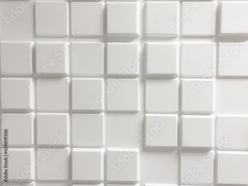 Abstract background. White cubes arranged at different heights.