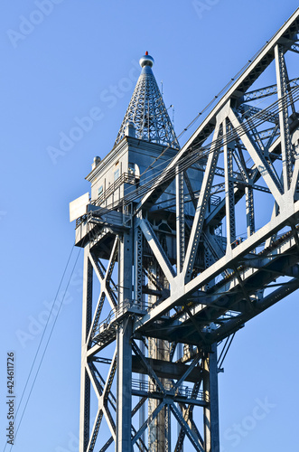 A closeup of the top part of a tower of the Cape Cod Canal Railroad Bridge, a vertical lift bridge in Bourne, Massachusetts near Buzzards Bay.