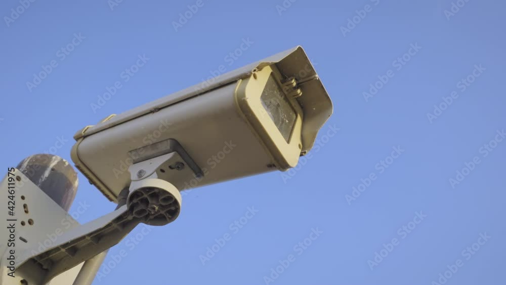 Security camera cctv video surveillance mounted on extremity steel pole and clear blue sky background, Old cctv cameras on to the top pillar on sunny day, Electronic camera monitor record,
handheld. Security camera cctv video surveillance mounted on extremity steel pole and clear blue sky background, Old cctv cameras on to the top pillar on sunny day, Electronic camera monitor record,
handheld.