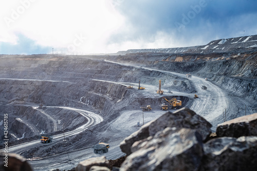 Work of heavy equipment in an open pit photo