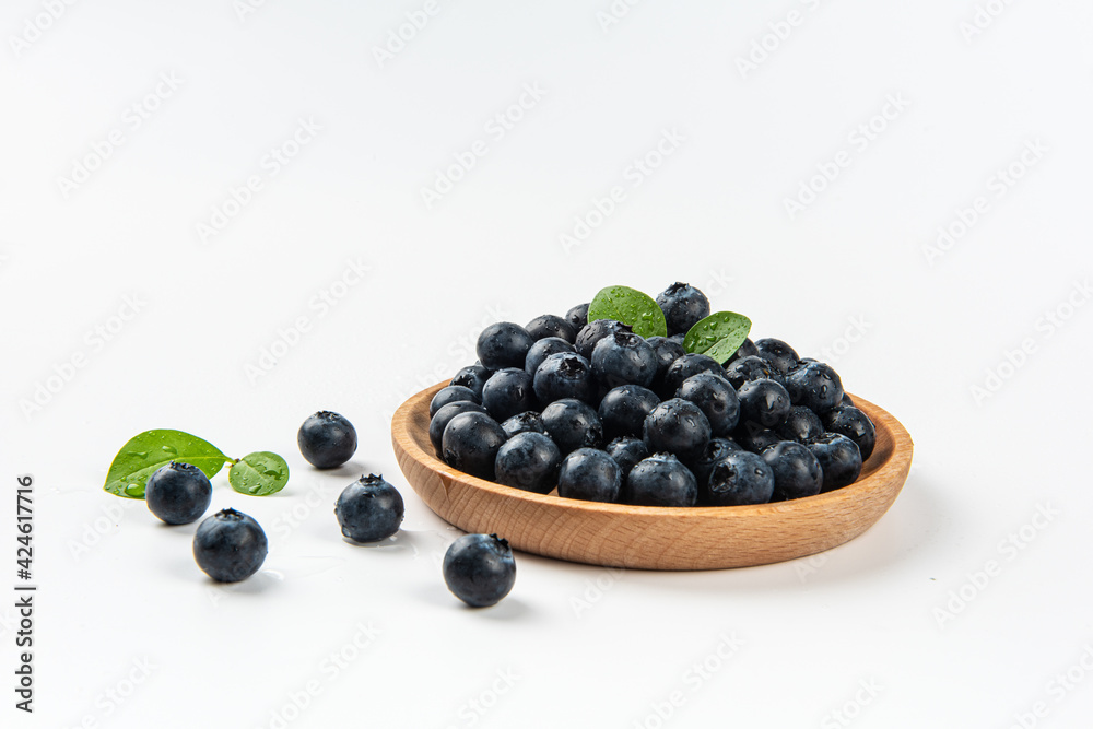 Fresh blueberry with drops of water on white background Fresh blueberry with drops of water on white background
