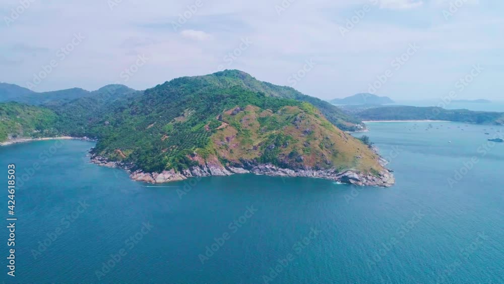 Amazing aerial view drone shot of beautiful mountain and tropical sea in summer season Location at Laem Krating Phuket Thailand Concept travel and tour background and travel website Amazing aerial view drone shot of beautiful mountain and tropical sea in summer season Location at Laem Krating Phuket Thailand Concept travel and tour background and travel website