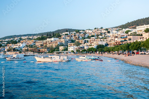 View of Bodrum beach, Aegean sea, white hotels, sailing boats, yachts in Bodrum, Turkey.