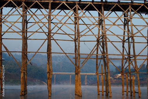 Sangklaburi or Myanmar tall wooden bridge on Songaria River