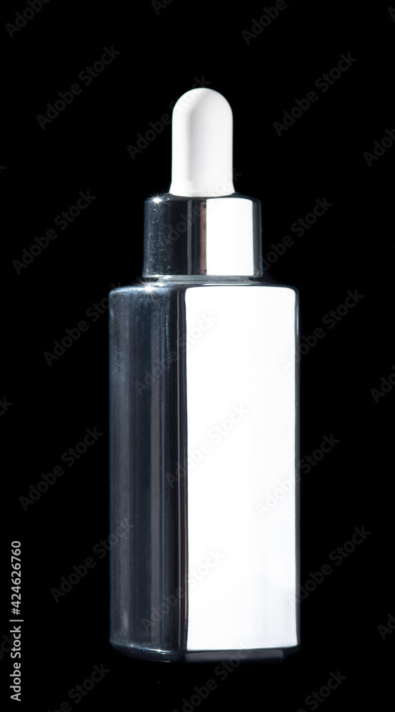 Serum bottle dropper cosmetic mock up on black background Serum bottle dropper cosmetic mock up on black background