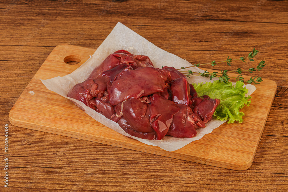 Raw chicken liver over board