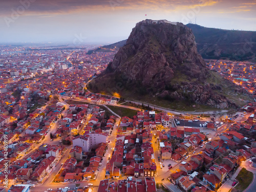 Drone view of Afyon ancient castle in the center of the Afyonkarahisar at sunset, Turkey. photo