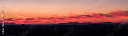 A panoramic sky landscape over the suburbs of Melbourne  Australia with Mt Dandenong on the horizon