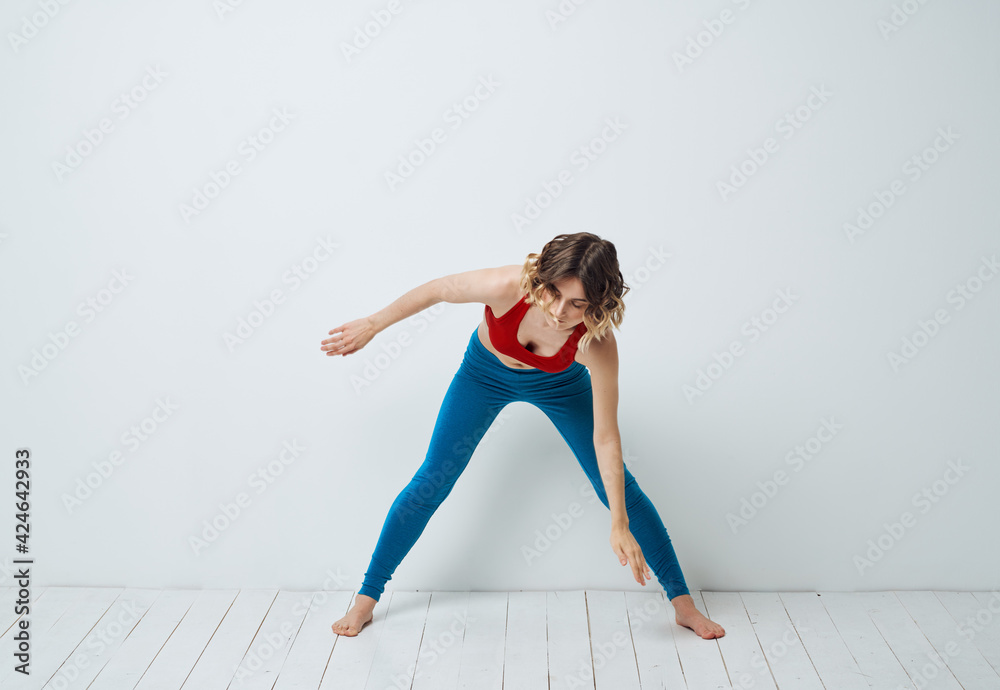 Woman spread her legs bent forward sport fitness gymnastics yoga Woman spread her legs bent forward sport fitness gymnastics yoga