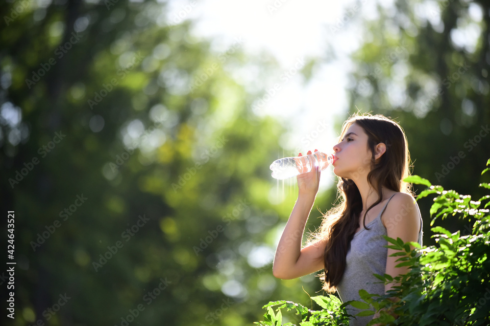 Healthy woman drinking water from bottle. Stay hydration concept. Unhidrated. Unity with nature, outdoor. Healthy woman drinking water from bottle. Stay hydration concept. Unhidrated. Unity with nature, outdoor.