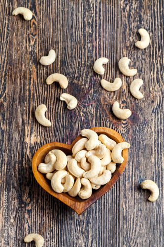 peeled cashews in a wooden plate