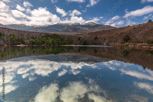 Reflection of a mountain in a lake. Mount Moncayo, Zaragoza Spain photo