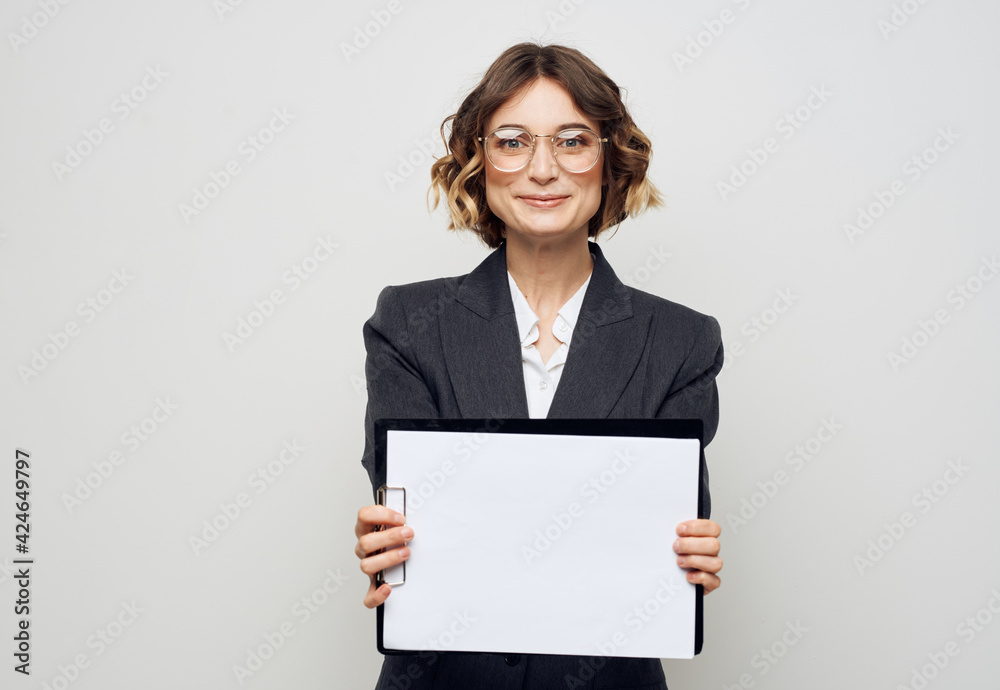 Business woman in classic suit white sheet of paper mock-up office work Business woman in classic suit white sheet of paper mock-up office work