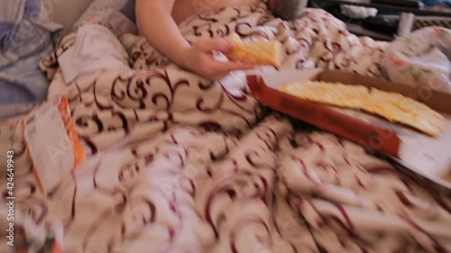 Wallpaper Mural The guy is caught eating pizza and drinking a milkshake. A hilarious shaggy fat man with a naked torso sits in bed and eats delicious cheese pizza. Breakfast in bed. Torontodigital.ca