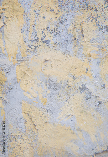 Old yellow gray surface. Cement wall with coarse texture. Decorative vintage background.