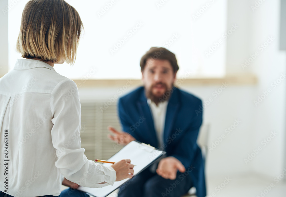 Emotional man at the reception of a psychologist consultation diagnosis Emotional man at the reception of a psychologist consultation diagnosis