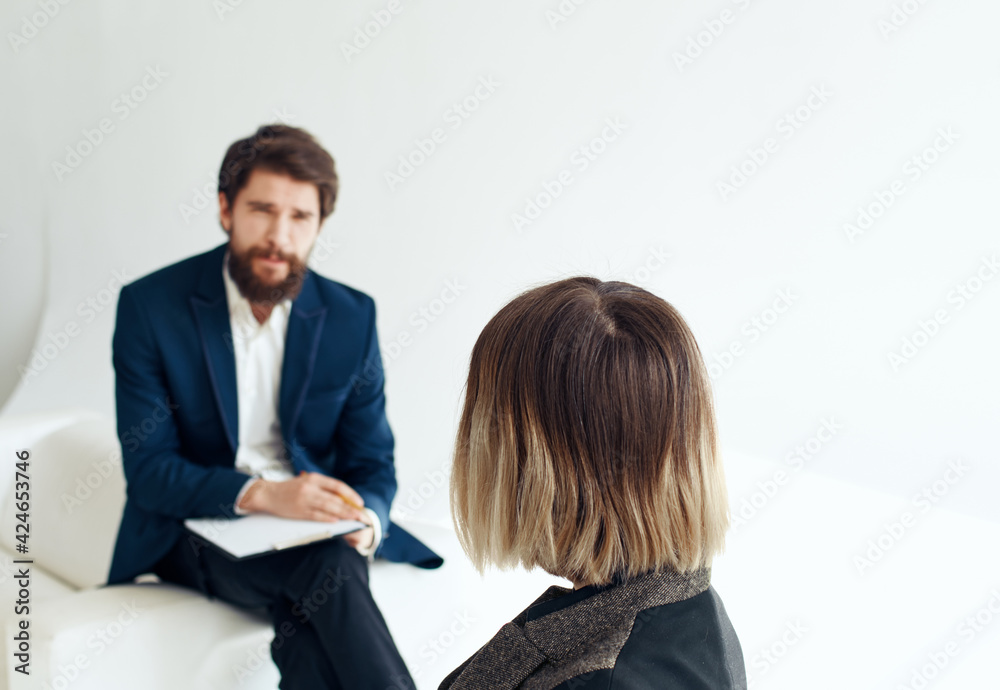Women and men in suits In the bright room of interviews hiring Women and men in suits In the bright room of interviews hiring