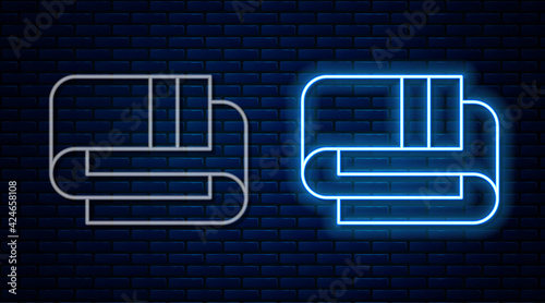 Glowing neon line Towel stack icon isolated on brick wall background. Vector