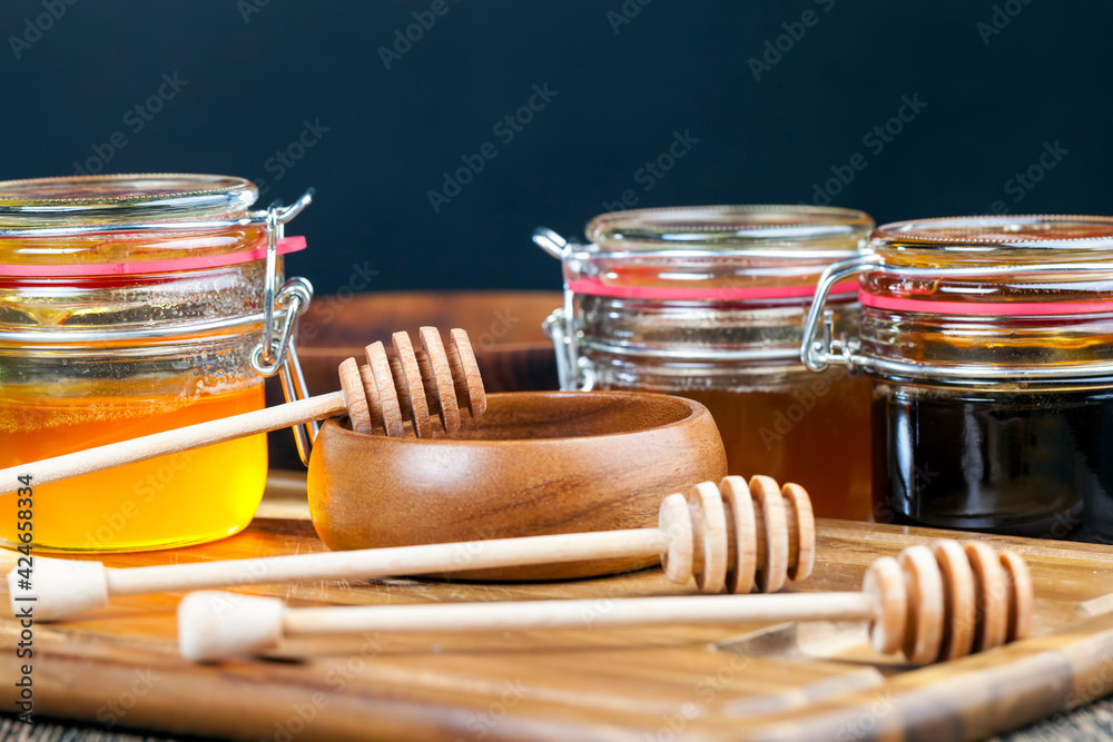flower honey from different varieties of flowers, bottled in different cans flower honey from different varieties of flowers, bottled in different cans