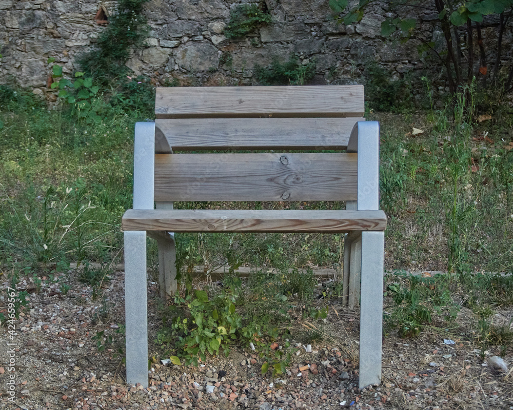 Beautiful Wooden Bench at a park on a sunny day Beautiful Wooden Bench at a park on a sunny day