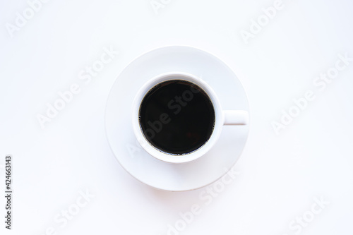 Flat lay of hot americano coffee in white coffee cup on white background