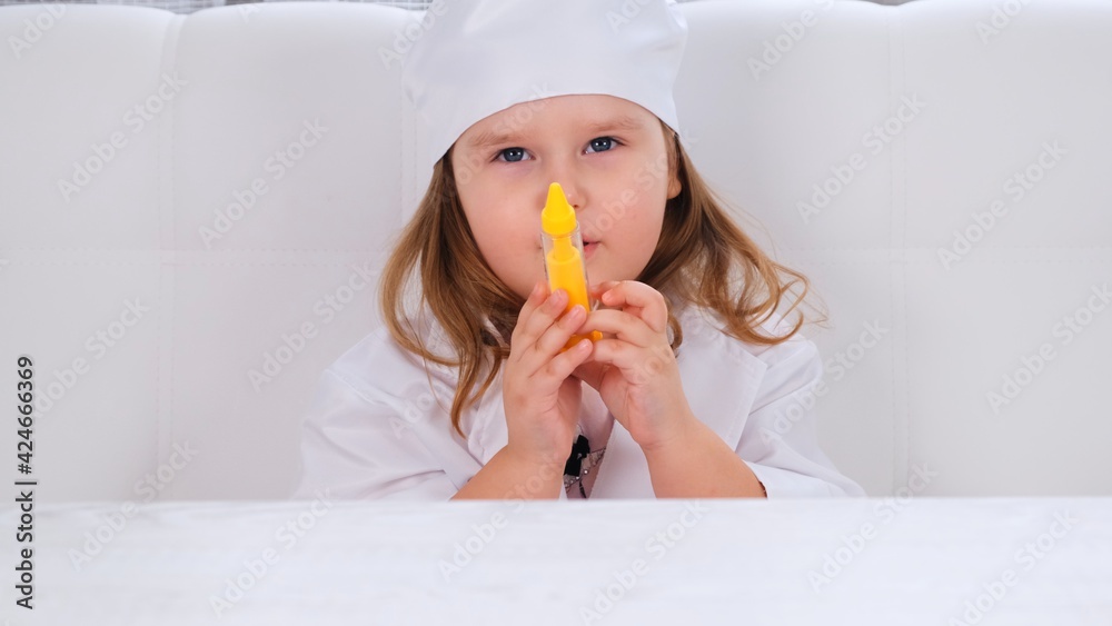little girl plays a doctor, makes an injection. Corona virus treatment concept, injection during pandemic little girl plays a doctor, makes an injection. Corona virus treatment concept, injection during pandemic
