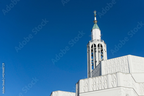 Saint Roch church in Bialystok city in Poland. White catherdal building. Empty copy space blue sky. Heaven background. Holy places in Europe. Architecture church tower. photo