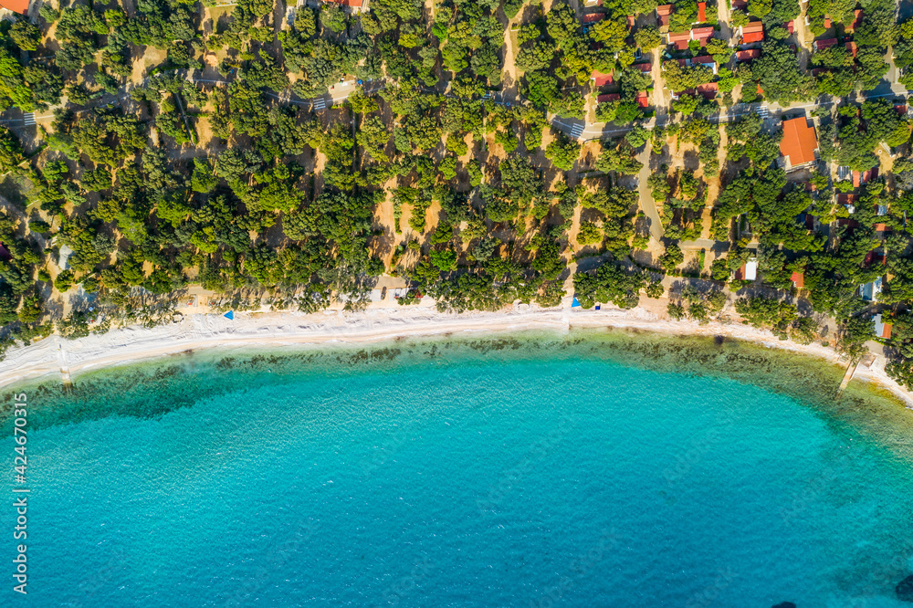 Beautiful coastline on the island of Pag on Adriatic sea in Croatia, tourist resorts and beach, overhead view