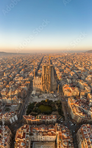 Aerial drone shot of Barcelona city center in Sunrise golden hour during Spain winter