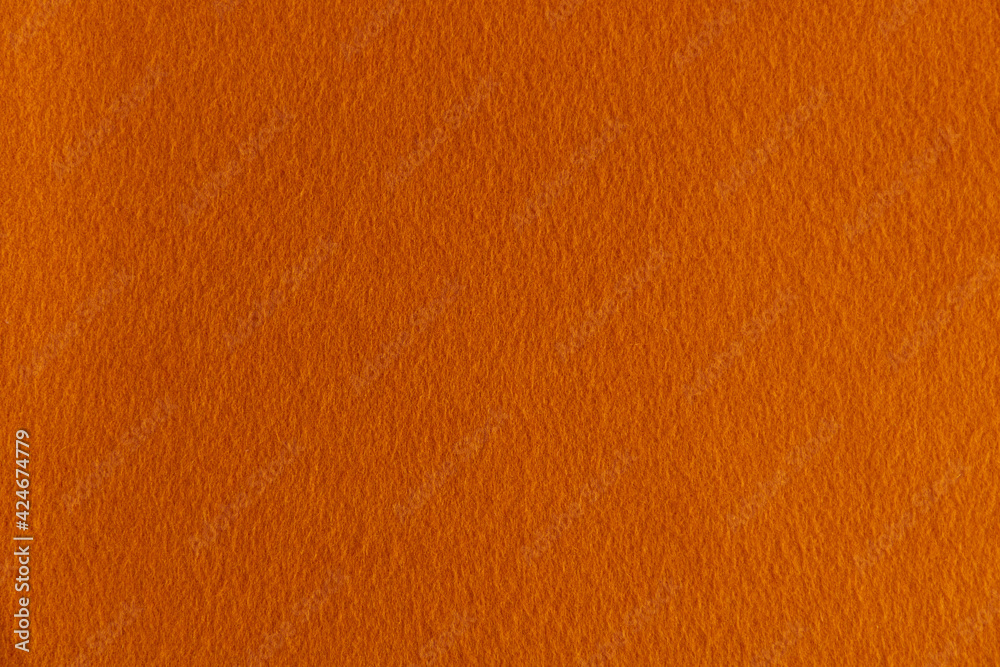 Fototapeta premium smooth surface of soft orange fleece, background, texture